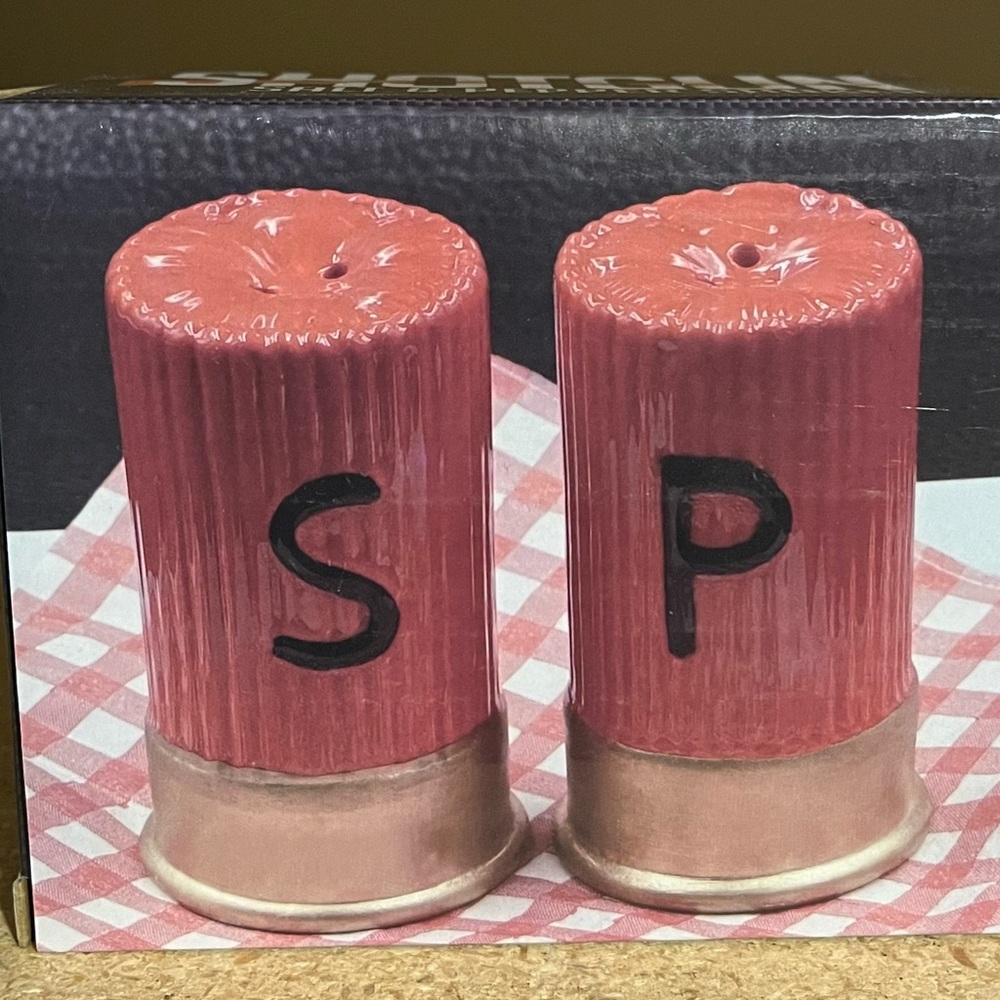 New in box! Shotgun shell-shaped salt and pepper shaker set. Great gift!